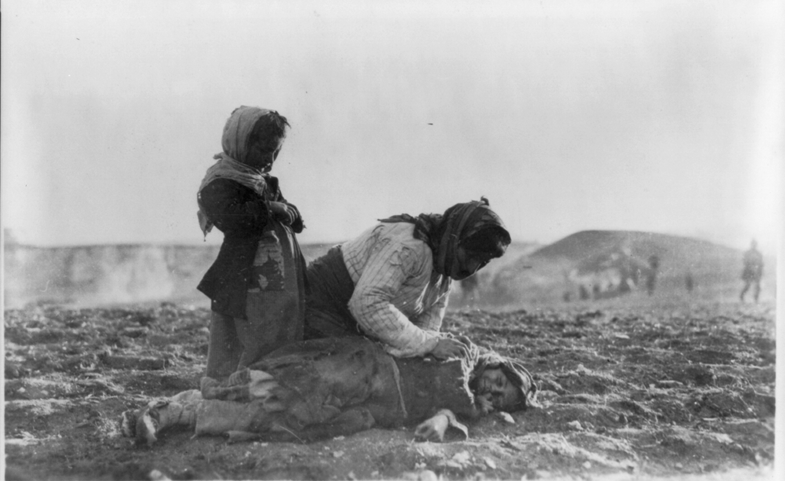 An Armenian mother and her daughter come across a fallen child on their way to Aleppo, Syria in 1915. This was during the Armenian Genocide, which claimed up to 1.5 million Armenians their lives. Some sources would sadly say this child is already dead, and that this was a common site even so close to safety as this family was.