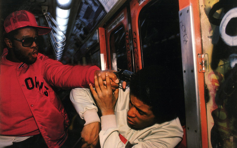 Photographer Bruce Davidson snaps this picture of an undercover police officer arresting a mugger who just tried to mug Bruce on a NYC, NY, US subway in 1985. The mugger is armed, hence the officers gun pointed at his head.