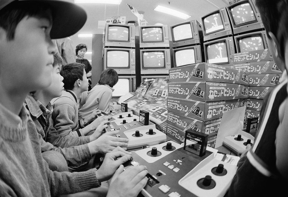 With Christmas just five days away youngsters swarm around the toy corner of a Tokyo department store to play with TV games, December 20, 1981.