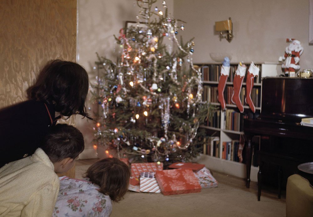 Children Peeking Around Corner at Christmas Tree