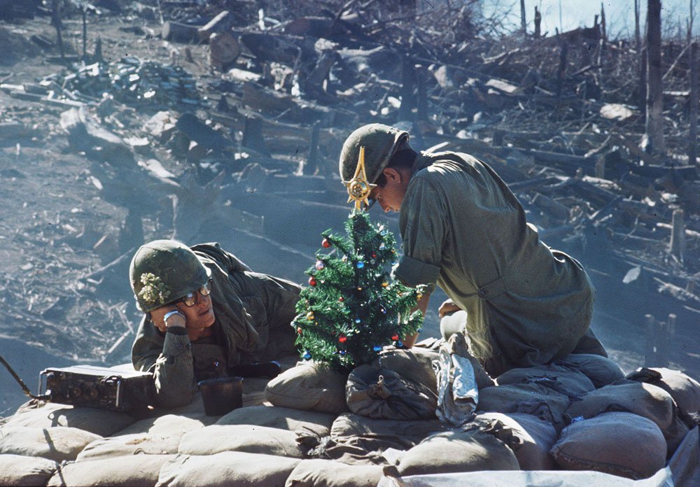 Picture taken 25 December of soldiers taking rest close to a small Xmas tree, on their position at the Hill 875 near Dakto, few days after the North Vietnamese Army made a massive assault.