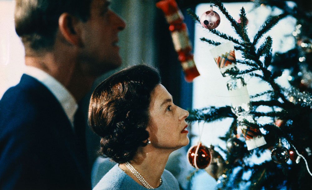 Christmas at Windsor Castle is shown here with Queen Elizabeth II and Prince Philip shown putting finishing touches to Christmas tree, in a photo made recently during the filming of the joint ITV-BBC film documentary, The Royal Family.