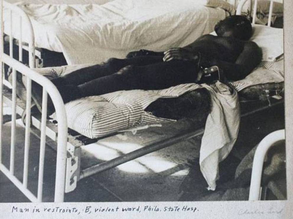 Violent Tendencies: 
In the violent ward of the Philadelphia State Hospital at Byberry in 1945, a man lies on a cot while restrained by his wrists.
