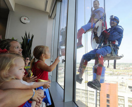 They are window washers cleaning Children's of Alabama hospital in Montgomery, AL.