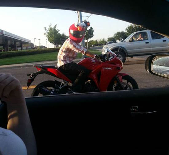 elmo riding a motorcycle