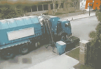 gifs - garbage truck  empty's trash into the air
