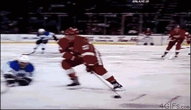 gifs - hockey player knocks into  net