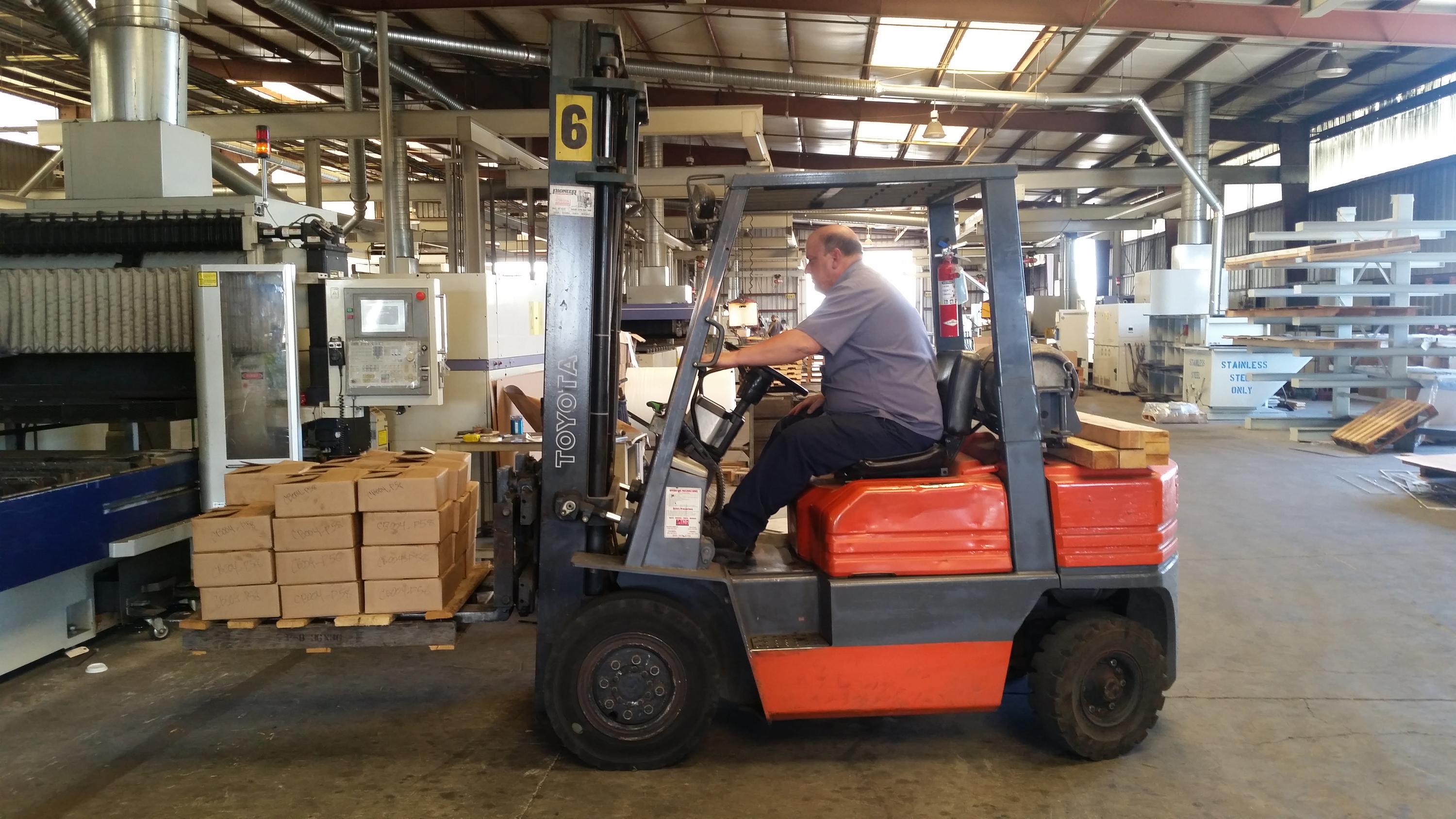 Fellow co-worker putts around on a forklift all day long. I call him... The Forklift Centaur. Even better is when you sing the song "The Stroke" and replace "stroke me, stroke me" with "fork lift centaur". Well I snapped a photo of him and his beloved forklift with hopes that someone might be able to turn him into an actual half man half forklift