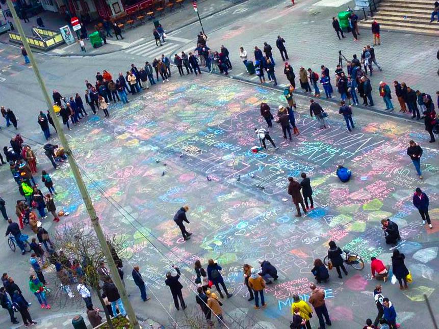 People in Brussels are coming out to write messages of love in the streets