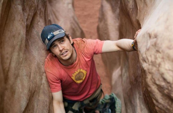 127 Hours (2011)
Despite the subject matter, this is a beautiful and poetic film. The story of the actual survival of Aaron Ralston, who had to cut off his arm to escape after being pinned by a boulder, this picture does a great job of distilling Aarons experiences and personality, as flashbacks and hallucinations to further characterize the hero. Meanwhile, we haven’t really left the canyon where he’s trapped. It takes a skilled filmmaker to tell such an all-encompassing tale, through one location. This one should be on every top 10 list.