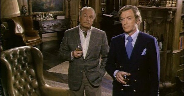 Sleuth (1972)
Based on a play by the same name, Sleuth stars cinematic legends Michael Caine and Sir Laurence Olivier, as two men that perpetuate an insurance scam, that involves a fake robbery. As it slowly grows out of control due to intrigue and betrayal, you see both characters start to fall apart. With a lot of misdirection and clever tricks, this film keeps you guessing until the very end, and doesn’t need to resort to cutaways to tell the story; the actors to a marvellous job themselves.