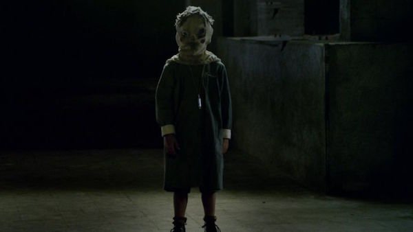 The Orphanage (2007)
This one wasn’t directed by Guillermo Del Toro, but his DNA is all over it. This ranks in my personal top ten list of horror films, because it’s so simple of a premise with a terrifying outcome. The woman who buys the orphanage in which she was raised, doesn’t know what horrors it’s going to bring to her, especially when her son goes missing. Then there’s the eerie masked kid. If he doesn’t make you shit yourself, I don’t know what will.