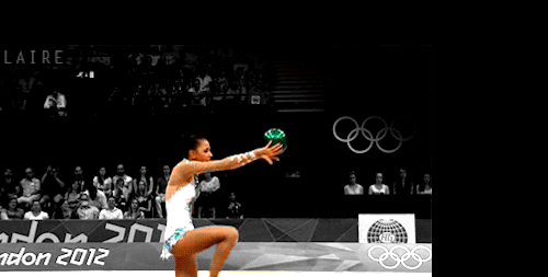GIF of girl with a ball at the olympics but motion stabalized around the ball