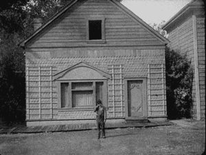 charlie chaplin stands at the right spot to not get hit by the house falling