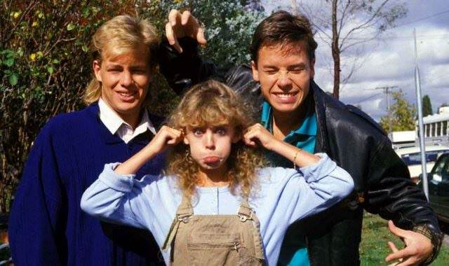 Jason Donovan, Kylie Minogue and Guy Pearce on the set of Australian soap opera "Neighbours" in 1987