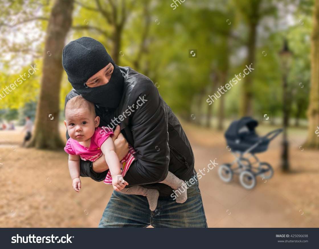 Man wearing balaclava snatched a baby that is very calm