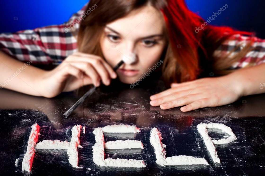 teen about to snort lines of coke of the word help
