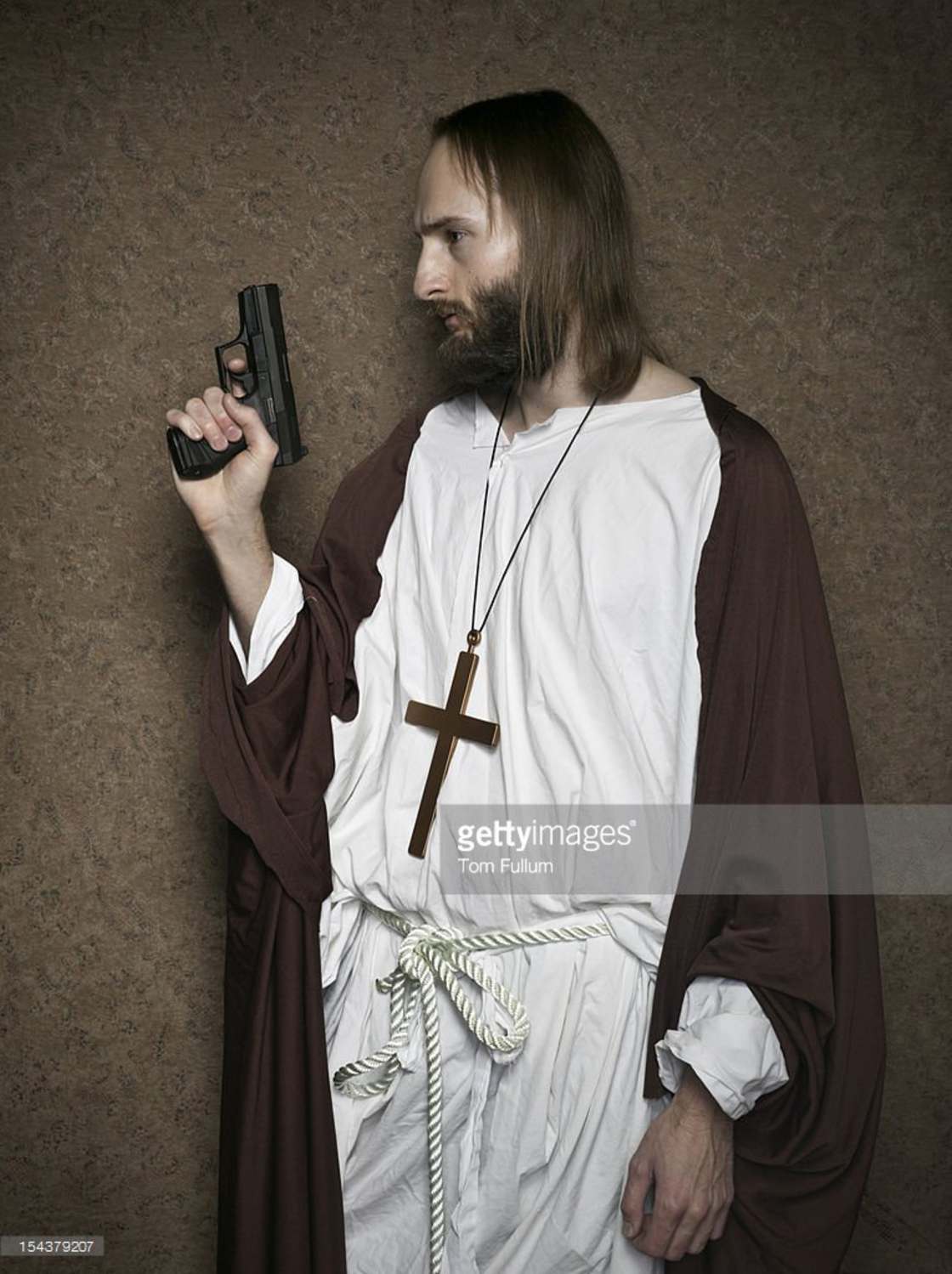 Priest with a gun