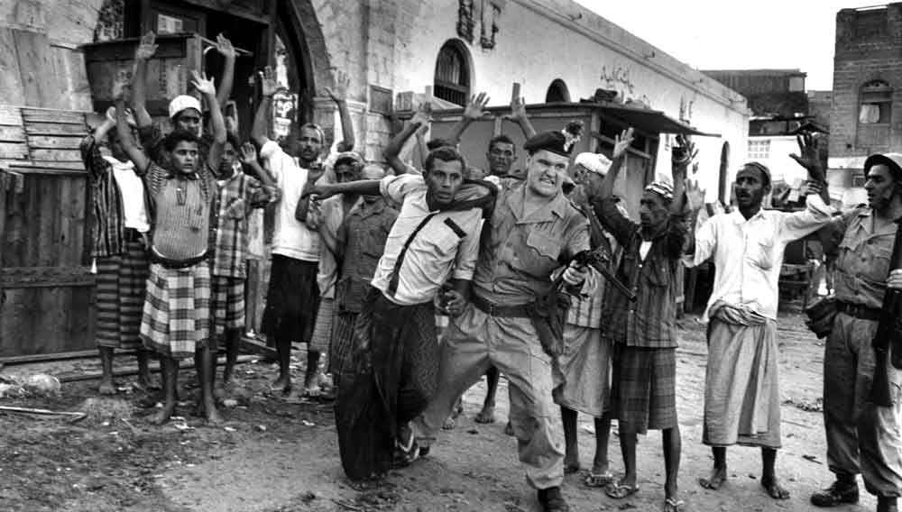 British soldiers question suspected insurgents during the Aden Emergency Insurgency in what is now Yemen in 1965. The uprising was a lot of protests and guerrilla warfare, with designed hit and run raids and assassinations against British targets. The British would often retaliate against locals, especially protesters by either jailing them or, in rare cases, executions. This uprising took 4 years before the British withdrew, and despite constant demonstrations, its death total was actually light when compared to similar uprisings in Africa and the Middle East around the time. Upwards of 100 British troops and 17 loyal South Arabian soldiers were killed, with nearly 600 combined wounded. Up to 400 insurgents were killed, with another 1700 wounded and countless others jailed.