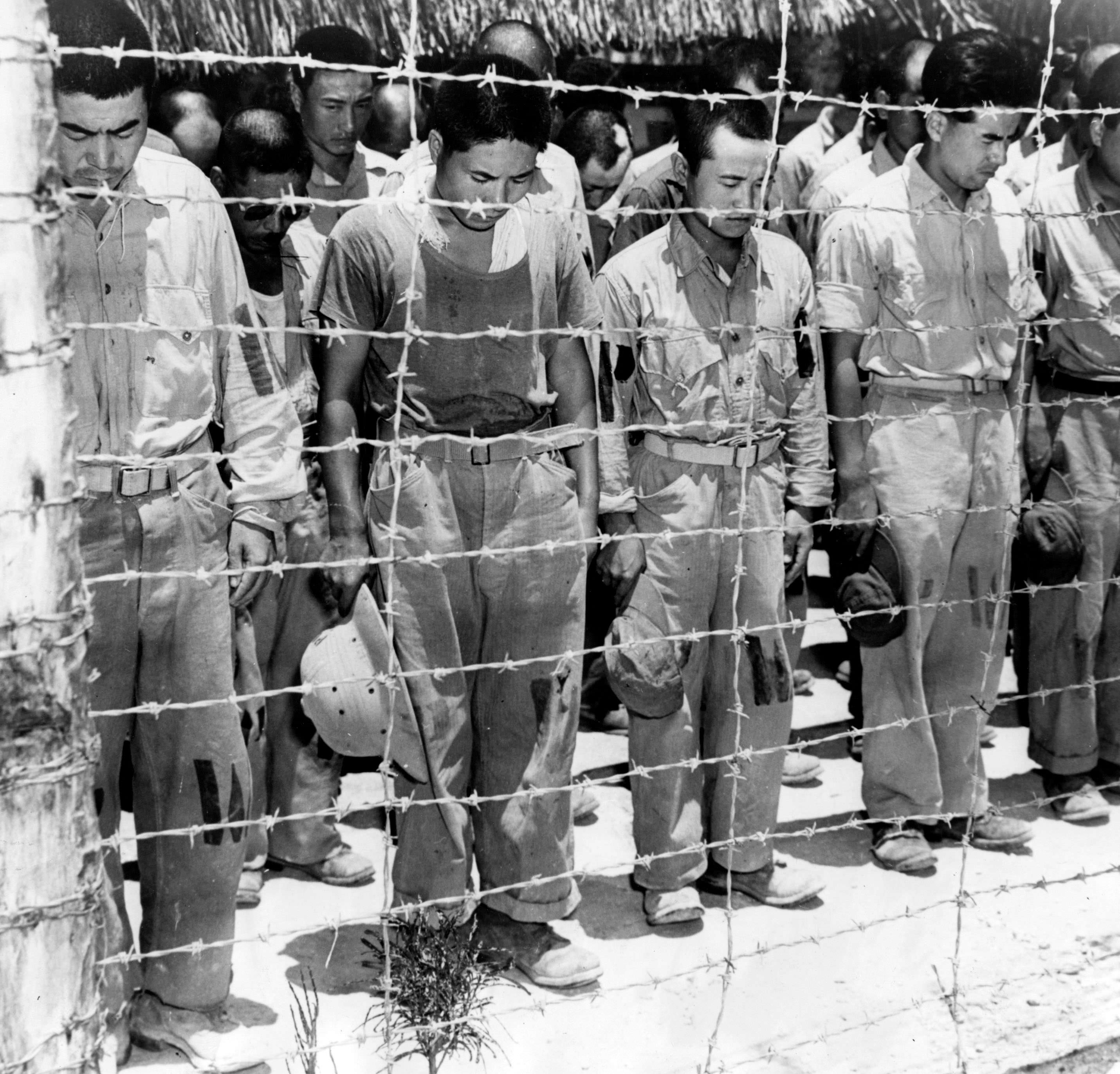 Japanese prisoners of war on Guam bow their heads as they listen to a radio broadcast of Emperor Hirohito announcing Japan's unconditional surrender in 1945. As the war came closer to an end, more and more Japanese soldiers actually did surrender rather than kill themselves or try suicidal attacks. It even got to a point where dropping the atomic bomb was questioned whether it was even necessary after how quickly Japan lost Manchuria when the Soviets began their advance in Asia. Its a debate historians still argue today as each side has valid points for the dropping and against it.