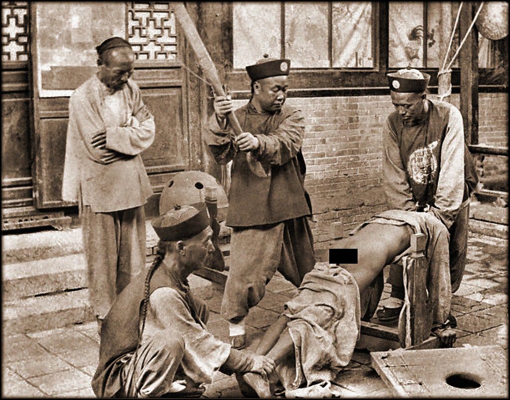Chinese officials punish a lawbreaker in Shanghai, China in the late 1800s. Whipping the mans butt with a paddle a certain number of times was a common punishment. They would also put prisoners heads through large wooden devices, tie them to a cross with their knees on sharp metals, and many other brutal torture tactics. Sadly, sometimes the crimes could be very minor, such as stealing a loaf of bread or insulting the wrong person.