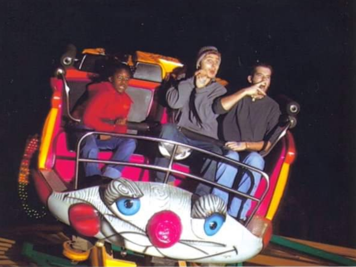 Came across this old photo from highschool taken on the "Crazy Mouse" ride at local Fair. Buddy and I screwing around for the camera as obviously terrified girl holds on for dear life.