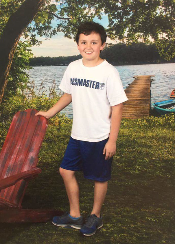 Portrait of a kid by the water and funny name on his shirt