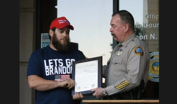 Retired U.S. Marine James Kilcer stopped a convenience store hold up by slapping the gun out of the perp's hand. He got an award for valor today.