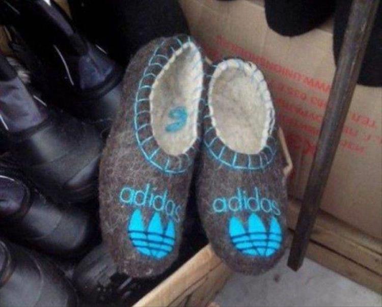 random pic of adidas slippers with turquoise logo and trim