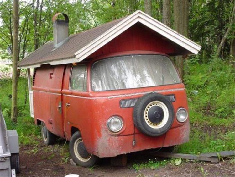 random pic or old volkswagen van made into a mini house with chimney