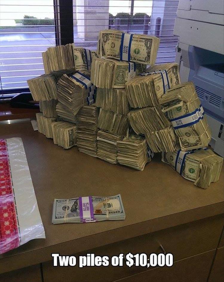 random pic of two piles of ten thousand dollars, one composed of hundreds and the other of singles