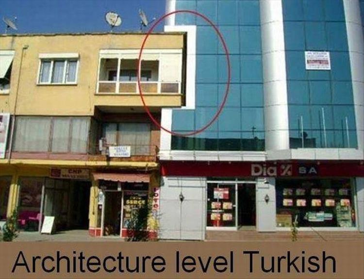 random picture of turkish architecture of a bite out of a sky scraper because of some old building