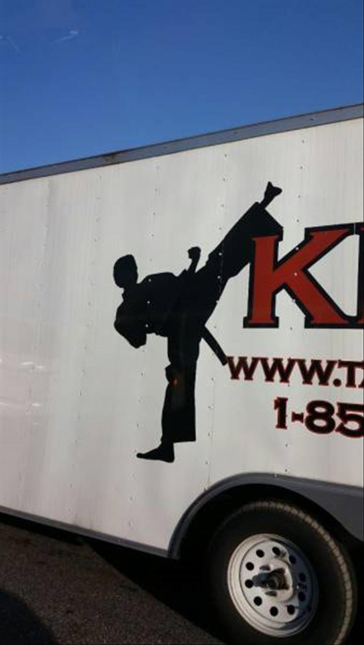 random picture of karate graphic on a truck and his belt looks confusing to say the least