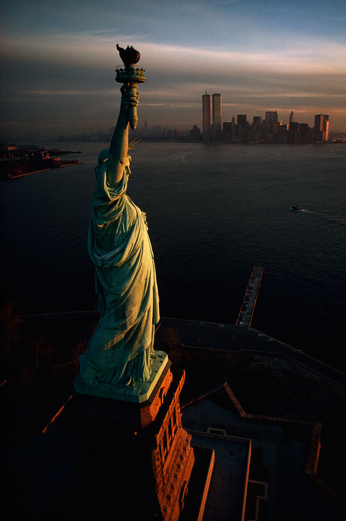 The Statue of Liberty hails dawn over New York Harbor in 1978Image source: David Alan Harvey