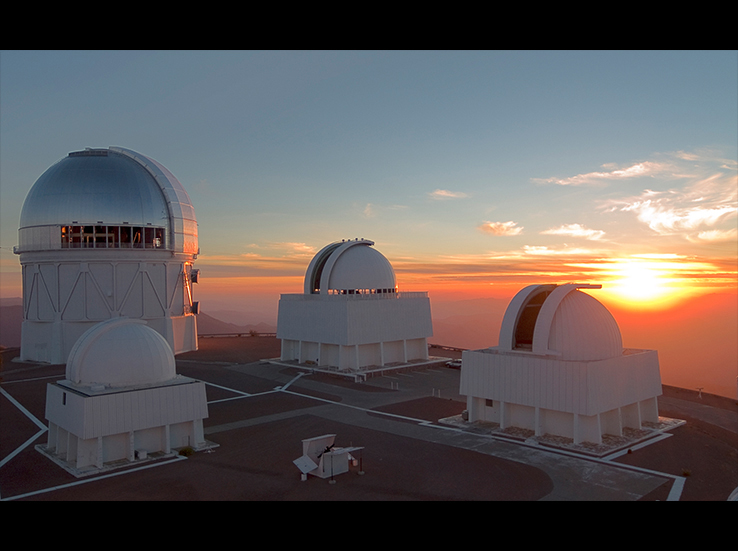 Resting on the flattened summit of Chile’s Cerro Tololo, the silvered-dome of the 4-meter Blanco Telescope and three of its neighbors catch the last rays of day, while preparing for nighttime observations. An integral piece of NSF’s Cerro Tololo Inter-American Observatory, the Blanco is nearly identical to Kitt Peak’s Mayall Telescope.

Image source: T. Abbott; NOAO/AURA/NSF