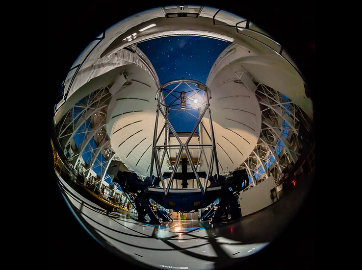 As the moon illuminates the interior of NSF’s Gemini South Telescope, astronomers gear up for a night of observation.