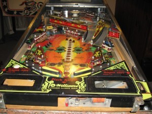 Black Knight (1980)
Black Knight is known for its two level playfield – the first of its kind. The game also introduced the Magna-Save, a player-controlled magnet used to prevent outlane drains. The pinball machine also has a loud riding bell instead of the old familiar knock when a special is won.