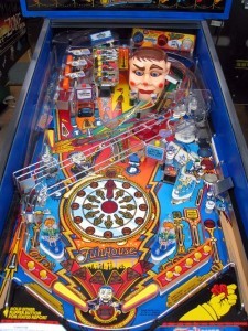 Funhouse (1990)
Funhouse is obviously themed after a funhouse – a walk through amusement park. Rudy is the talking doll head near the upper right corner of the playfield. His eyes seem to follow the ball during game play, and he responds to events in the game. The goal of the game is to advance the time to midnight, causing the Funhouse to close. Player enters multi-ball mode at midnight.