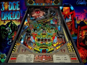 Judge Dredd (1993)
This pinball machine was based on a character from the British comic series “2000 AD” (1970s). Judge Dredd has a diamond plate playfield, and players must go through 9 modes and an Ultimate Challenge wizard mode to complete the game. One of the coolest features of this game is that players can choose to play the regulation game for one credit or the super game for two credits – both on one machine.