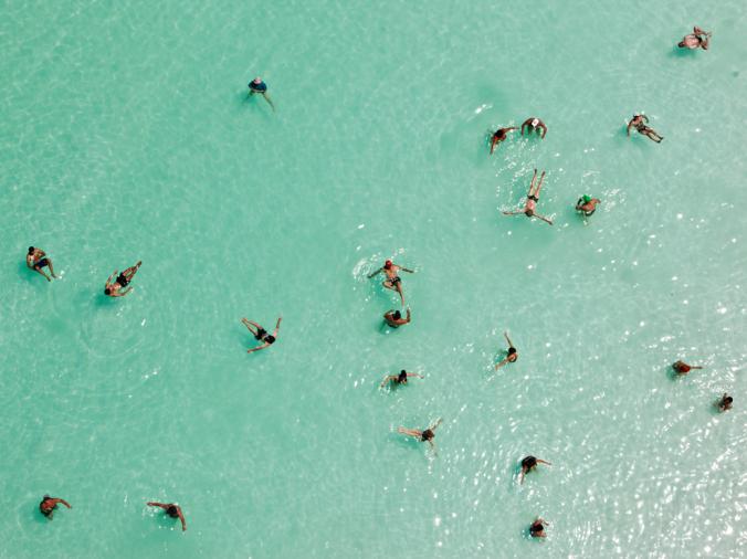 DEAD SEA, ISRAEL
Swimmers float effortlessly in the salt-laden waters of the Dead Sea near Ein Bokek, Israel. Ten times saltier than seawater, the lake is extremely buoyant and a popular destination for holidaymakers. It's also Earth's lowest point on land.
PHOTOGRAPH BY GEORGE STEINMETZ, NATIONAL GEOGRAPHIC