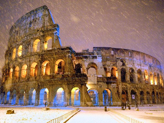 COLOSSEUM, ROME
A rare snow shower falls on Rome's Colosseum, built 2,000 years ago to host gladiator duels, battle reenactments, and other public spectacles. Today the 50,000-seat amphitheater serves Rome in another capacity: as a major tourist attraction.
PHOTOGRAPH BY GABRIELE FORZANO, REUTERS