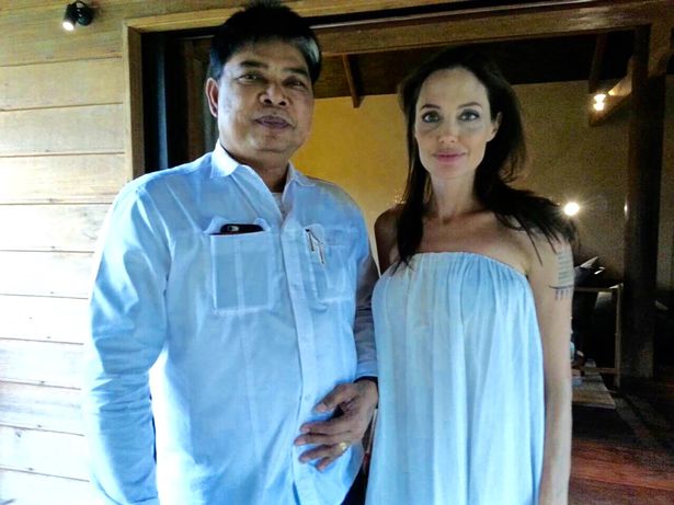 Thai monk gives Angelina Jolie painful tattoos 'binding her' to Brad Pitt - just before their marriage fell apart