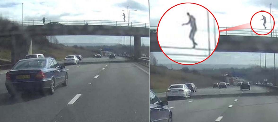 The figure was spotted by shocked motorists above the carriageway on the M60