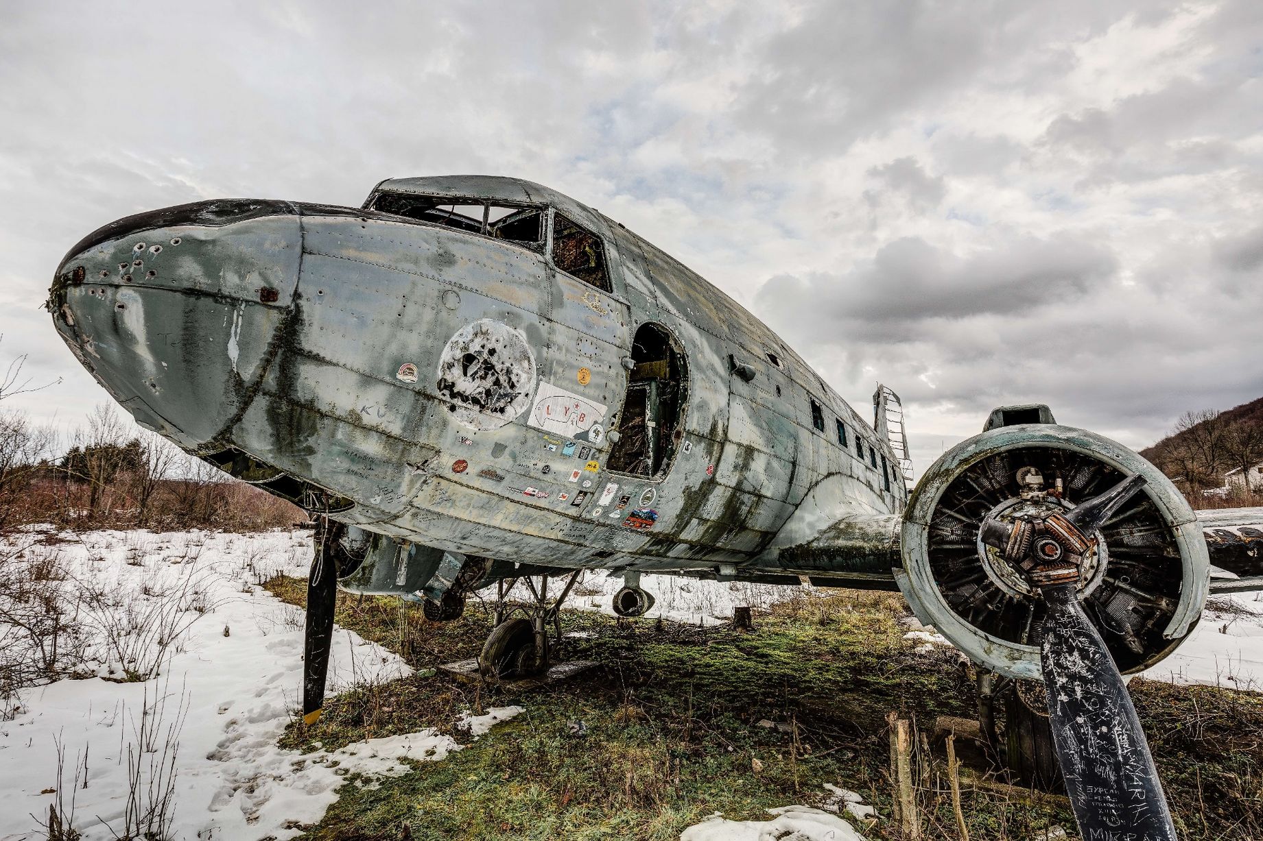 A military plane has been left to rust at the former air base which was destroyed in the war in 1992