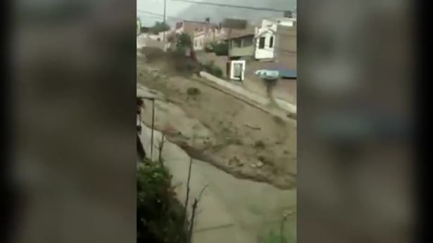 Massive mudslide comes crashing down a residential street
