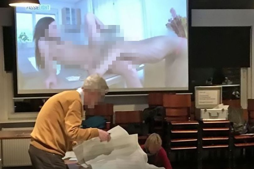 They can be seen focused on the task at hand while two women perform a sex act on the screen behind them.

A practical joker is thought to have put the porn on at the polling station, in the city of Enschede in the eastern part of the Netherlands.