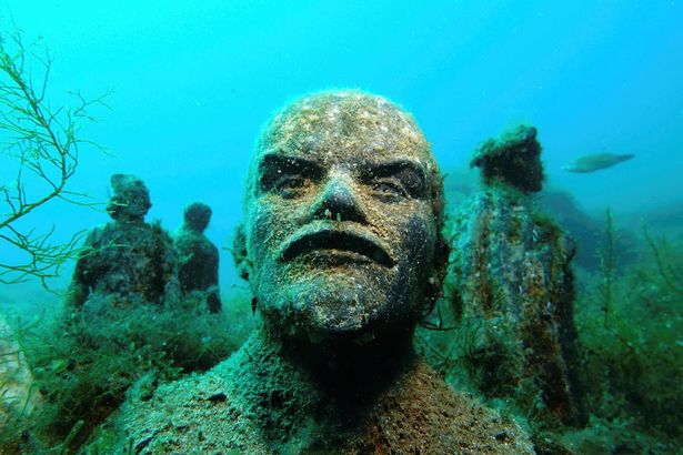 A bust of Soviet state founder Vladimir Lenin with Soviet-era sculpures are seen at the "Alley of Leaders" underwater museum off the coast of Cape Tarhankut, Crimea