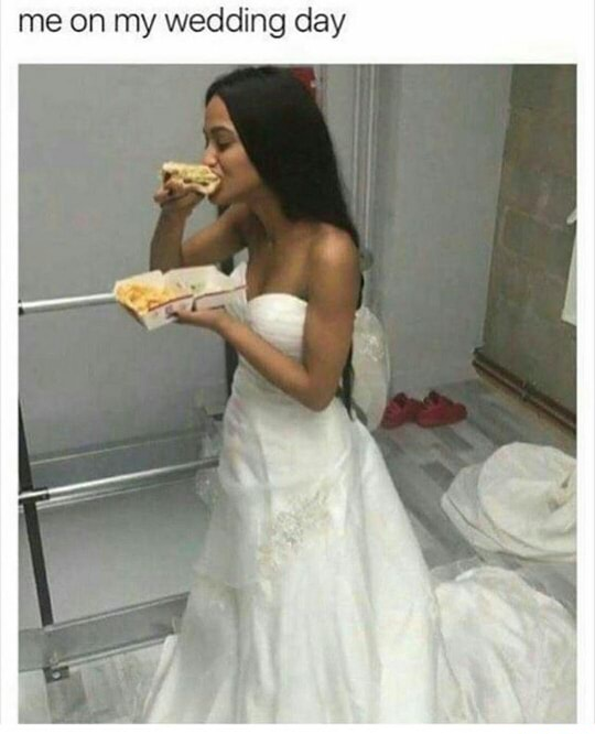 Woman in wedding dress stuffing pizza in her mouth.