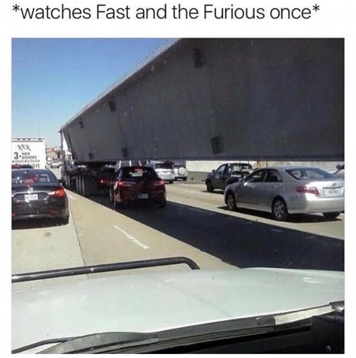 Crazy picture of a dude driving under a truck with a caption that he just saw Fast and Furious once.