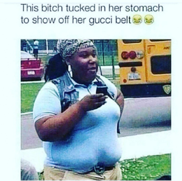 Funny picture of a fat black woman that tucked in her shirt to show off her Gucci belt.